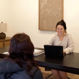 two women sitting at a table
