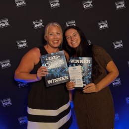 two women holding flyers